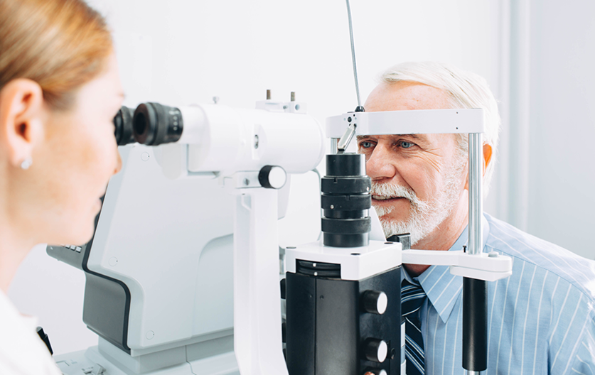 A man is getting his eyes tested by Optometrist
