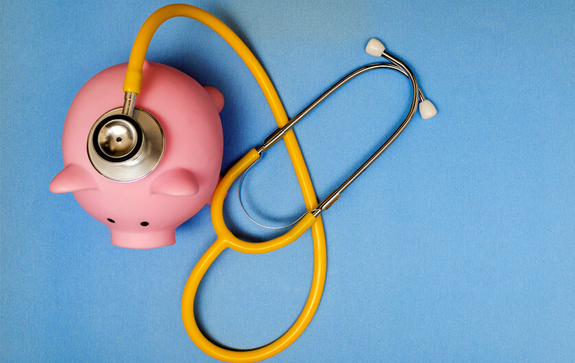Piggy bank with stethoscope
